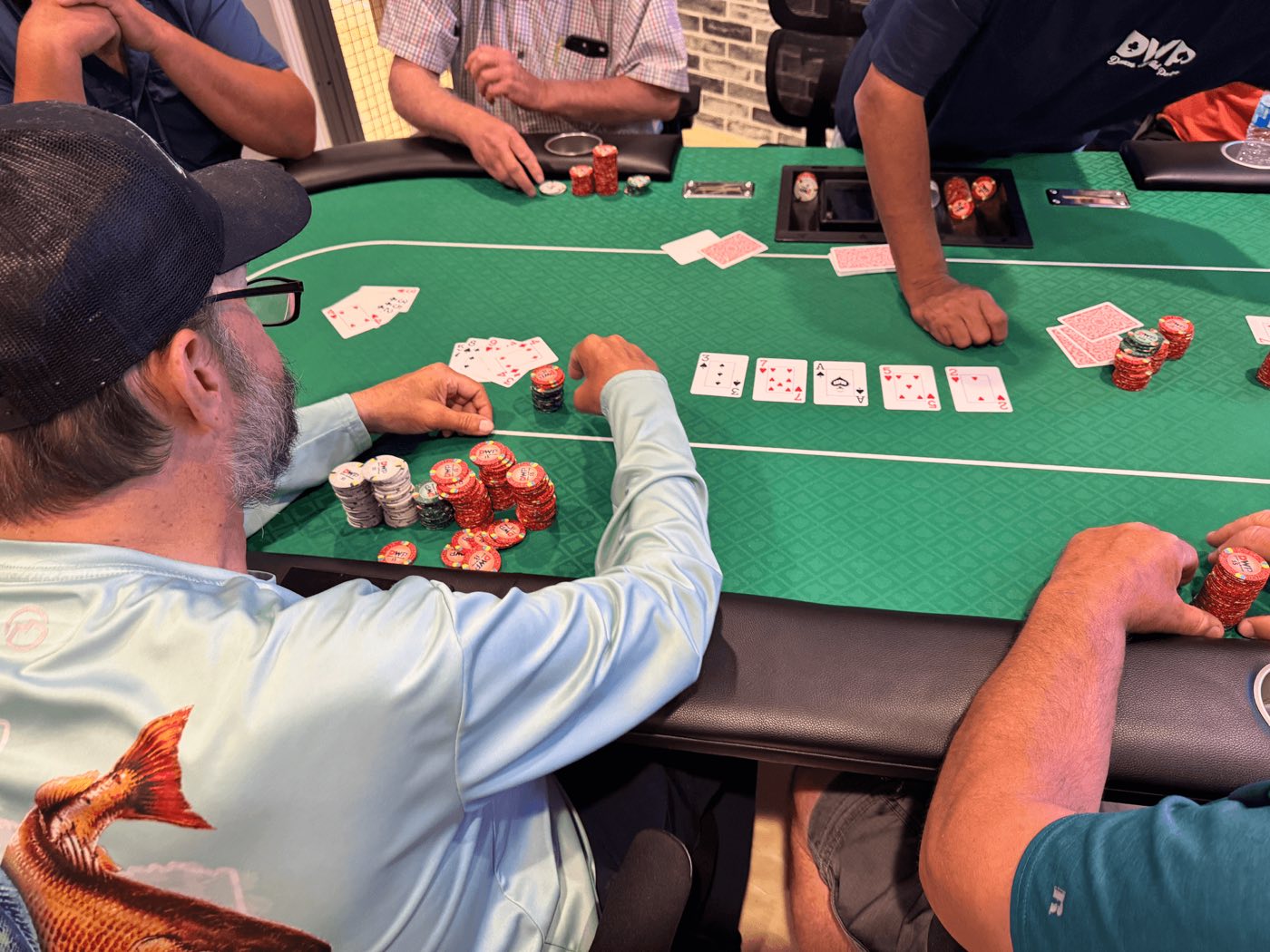 A hand in progress at Deuces Wild Poker Club